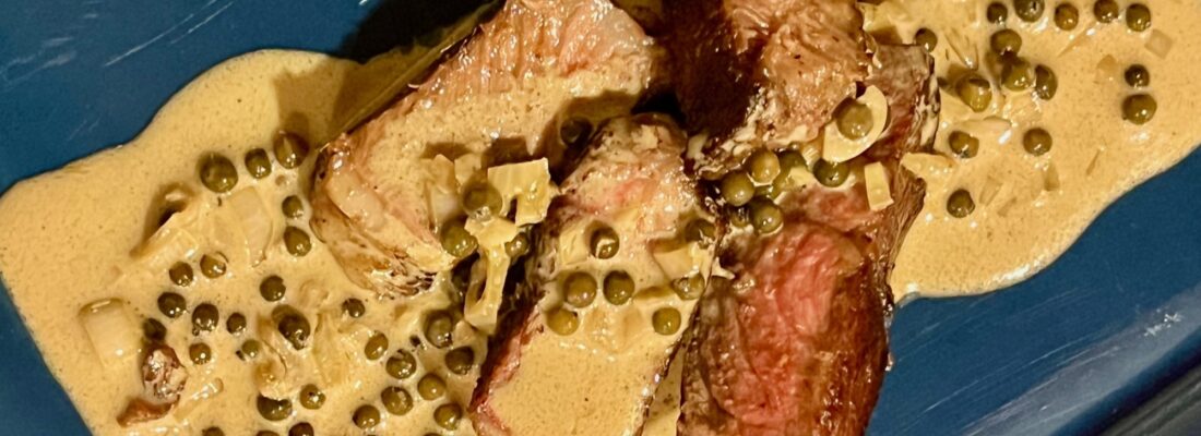 Green Peppercorn Sauce on Steak Horizontal
